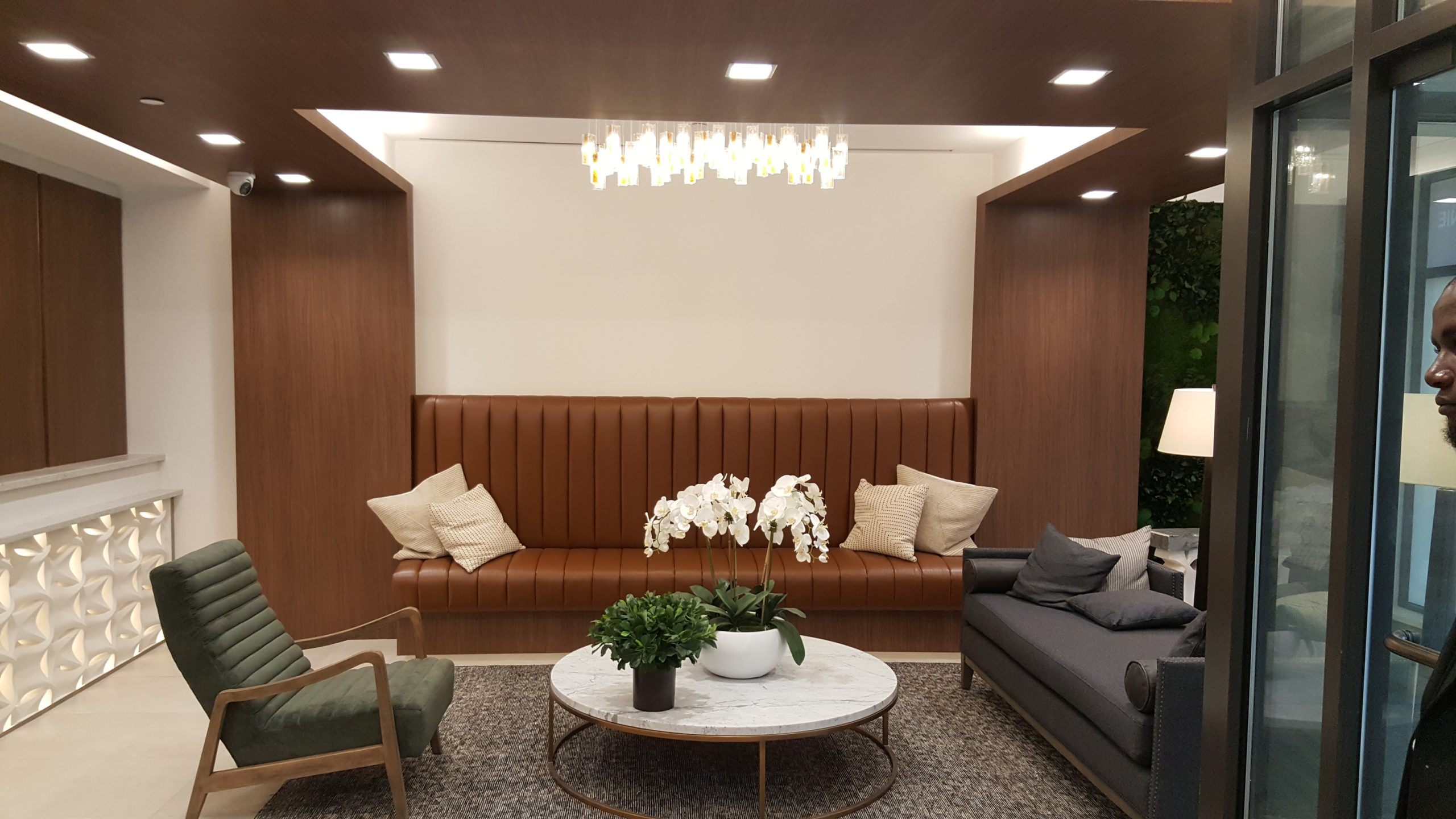 Grand Lobby — Custom Curved Sofa, Marble Staircase